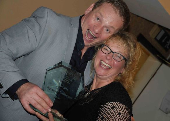 Ger Kennedy tries to take it back but Siobhan has both hands on the award.