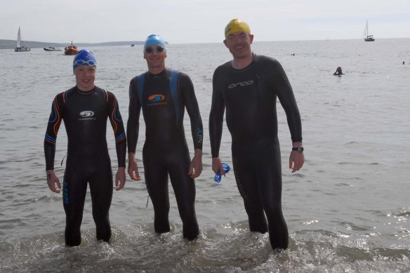 Dipping their feet into the ocean at the start of the Myrteville to Church Bay RNLI Sea Swim were Chris Mintern, Fermoy with Trevor Woods, Ballincollig and Padraig Maguire from Douglas (pic Howard Crowdy)