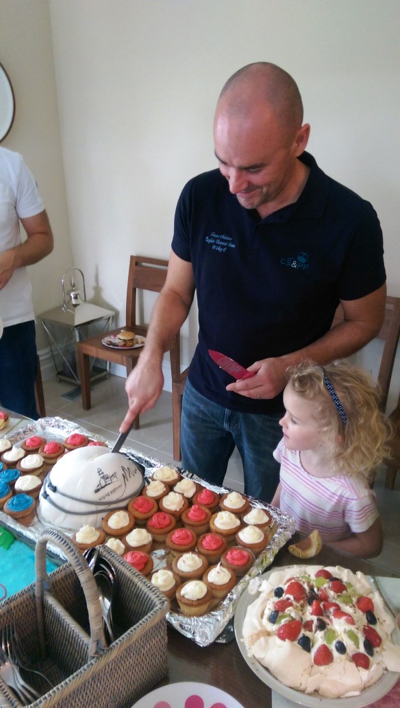 Trevor with daughter, Cliodhna supervising the cake cutting.